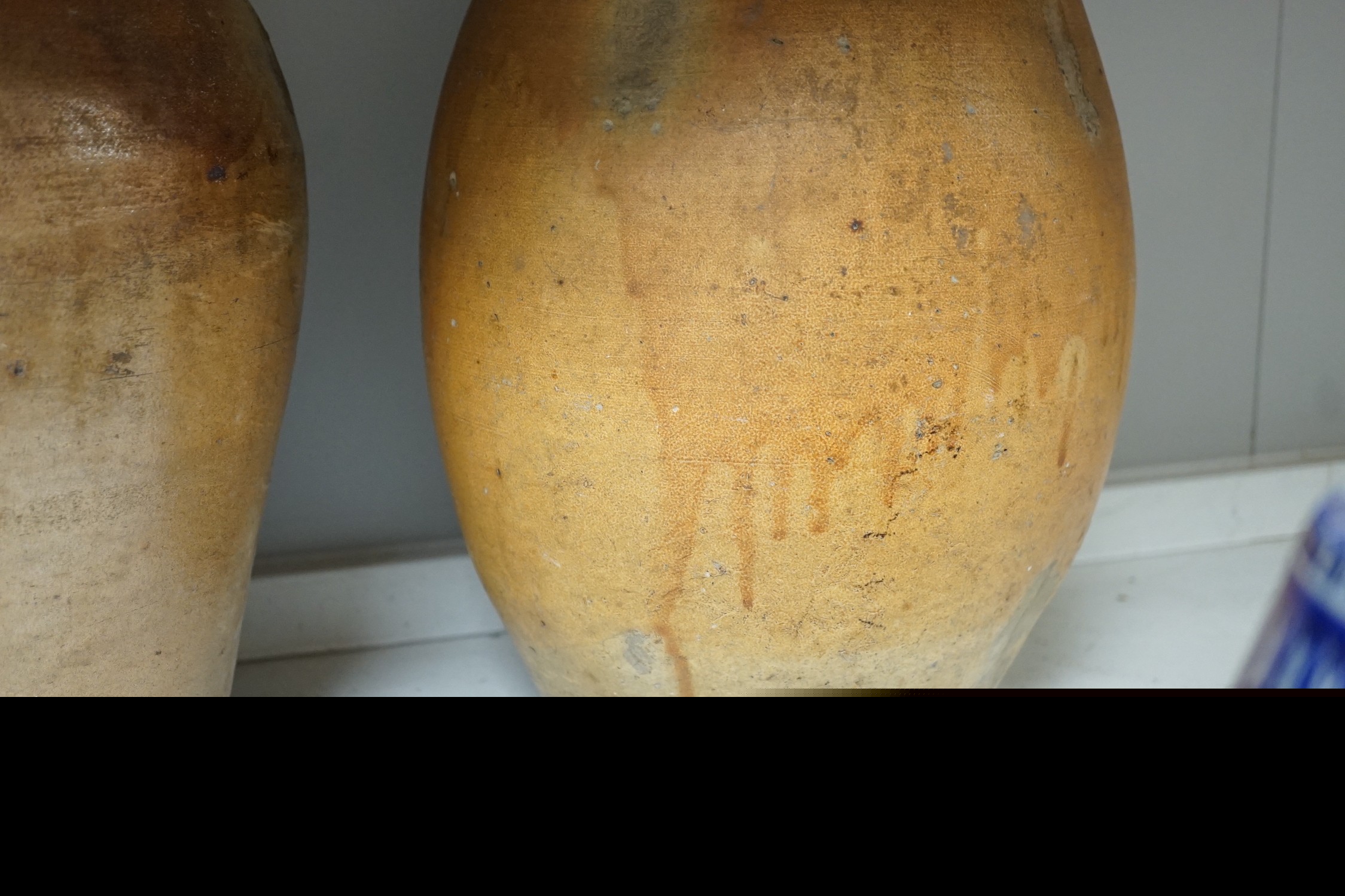 Two 19th century salt glazed stoneware flagons, tallest 44cm